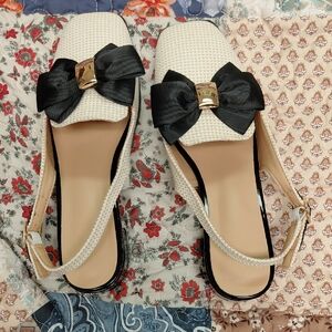 Cream Slingback Flats with Black Bow Accent